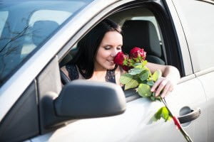 Smelling-Roses-Outside-Car